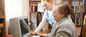 an old woman doing computer training